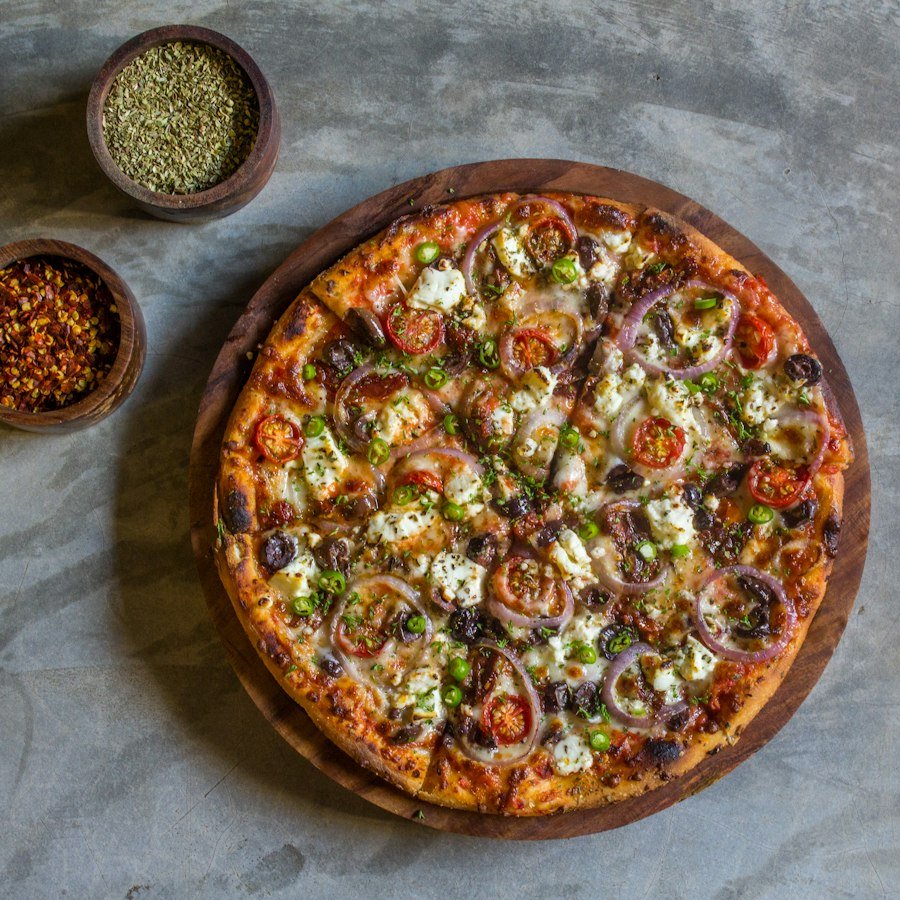 Americano Pizza Market Deeping with pepperoni, mushroom and peppers from Eastern Promise