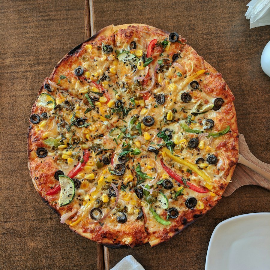 Mexicano Pizza Market Deeping with keema, pepperoni, onion and peppers from Eastern Promise