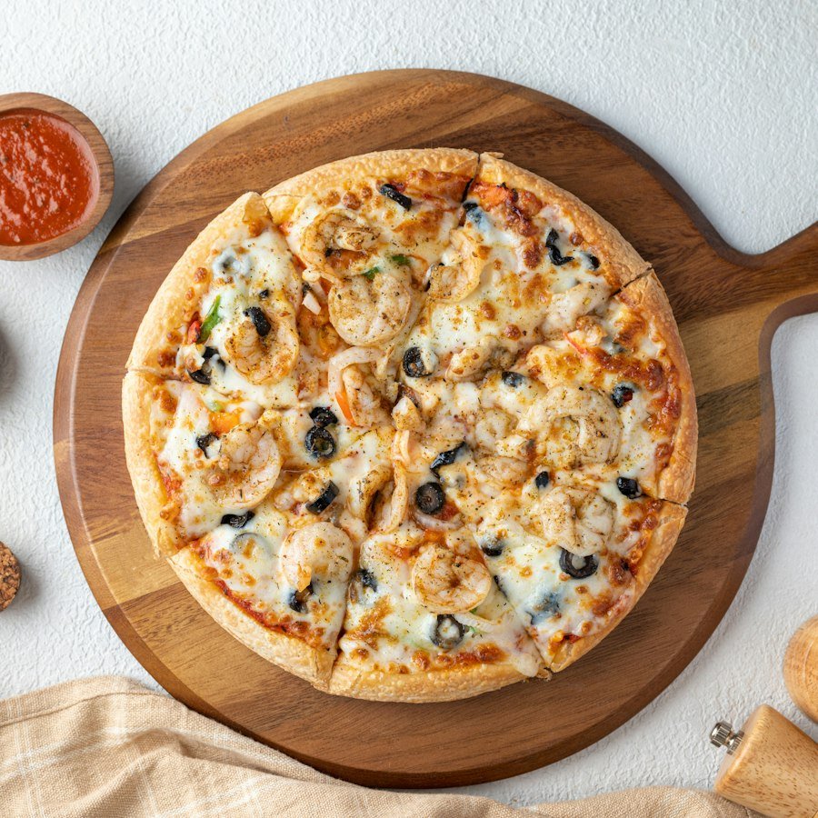 Tandoori Hot Pizza Market Deeping with tandoori chicken, jalapenos and chillies from Eastern Promise